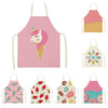 A set of colorful linen kitchen aprons featuring various patterns and pink, green, and yellow colors.