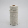 A spool of cream-colored macrame cord, made of 100% cotton, used for crafting.