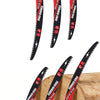 A set of red and black curved edge STI Pro CR-V reciprocating saw blades for wood pruning, shown individually and partially i