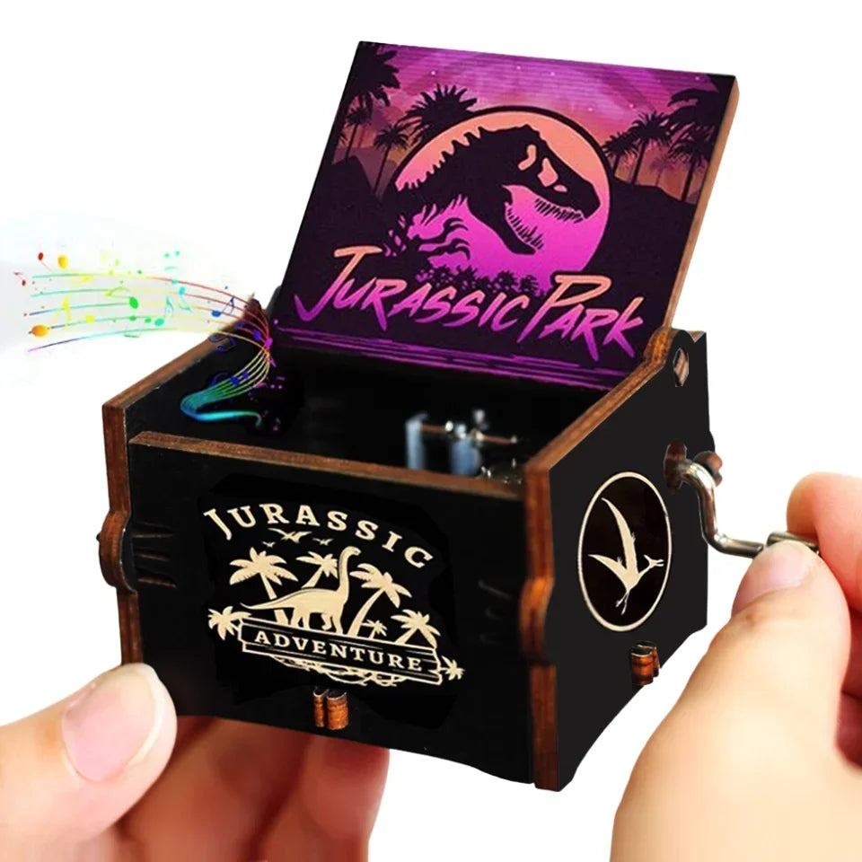 A wooden music box featuring a Jurassic Park theme with a dinosaur silhouette and jungle scenery.
