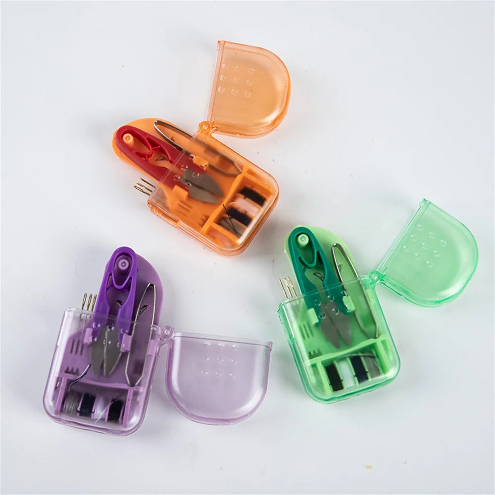 A set of compact portable sewing kits in various colors including orange, pink, and green, displayed on a white background.