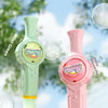 Pink and green bubble guns with colorful lights set against a bright outdoor background.