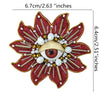 A large, reddish-brown floral patch featuring a gold eye design with white and brown beads and rhinestones.