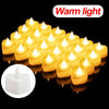 A cluster of warm light heart-shaped flameless LED candles glowing brightly against a black background.