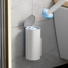 A wall-mounted disposable toilet brush set with a white container and blue sponge heads mounted on a gray marble tile.