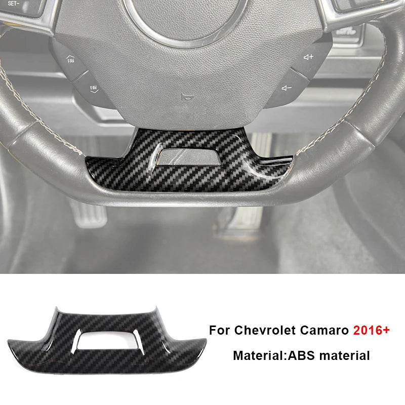 Black carbon fiber trim piece for Chevrolet Camaro interior steering wheel.