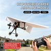 A white RC powered paper airplane model is shown in flight against a cloudy sky.