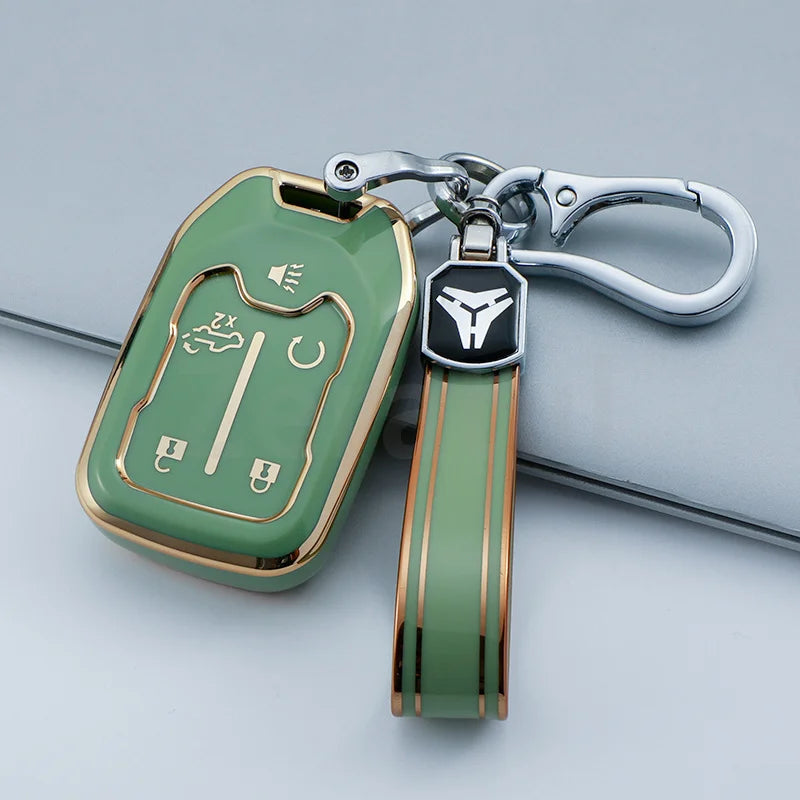 A green TPU smart key fob cover with a silver chain and black key tag attached to a metal keyring.