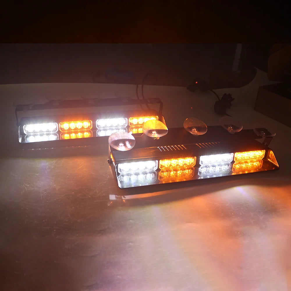 A close-up of emergency dash strobe lights with high-intensity LED safety flashers illuminating a surface.