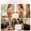 Two young women smiling while holding a white floral quilted Bible cover with a zipper pocket and carry handle.