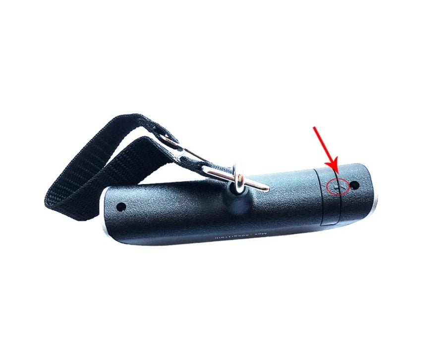 A black portable digital luggage scale is shown, highlighting the LCD display area.