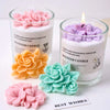 Silicone molds of pink, orange, and green flowers used for scented candle and soap making