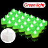 A row of bright green heart-shaped flameless LED candles glowing on a black background.