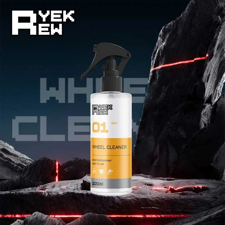 A bottle of yellow wheel cleaner is shown against a dark, rocky background with red light streaks.
