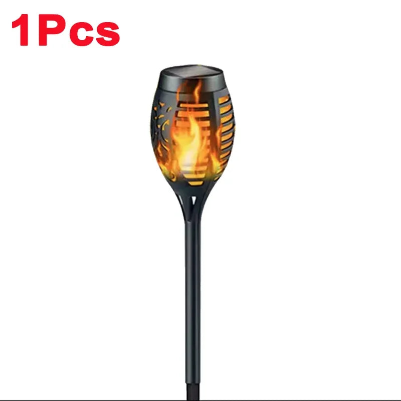 A black solar flame torch light with a metal grilling grate is shown.
