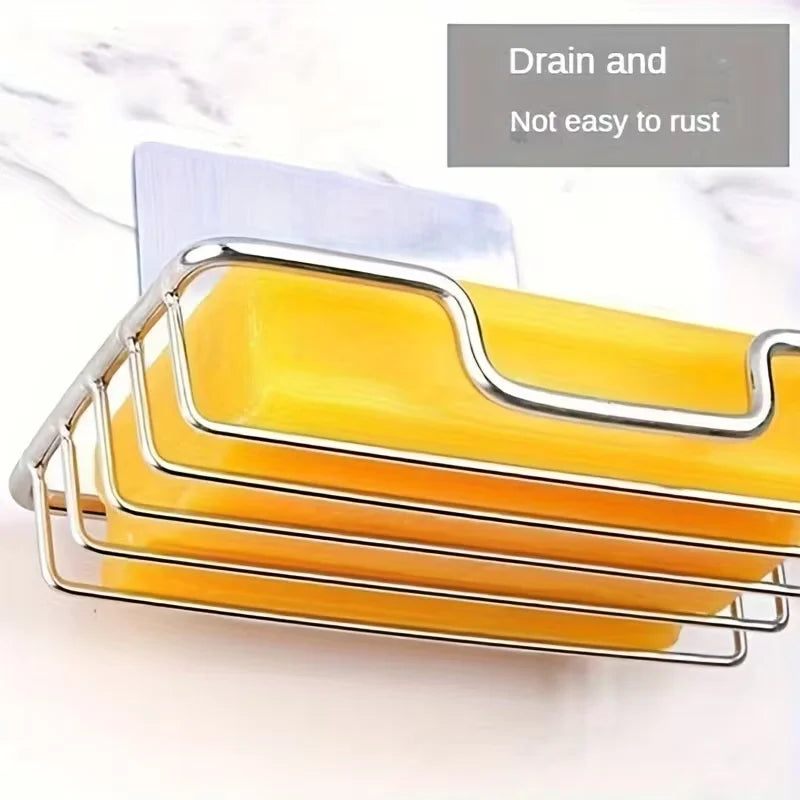 Stainless steel wall-mounted soap dish with yellow soap, designed to drain and not easily rust.