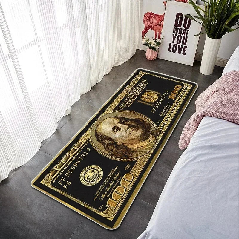 A rectangular gold and black banknote pattern anti-slip floor mat placed on a gray floor next to a white bed.