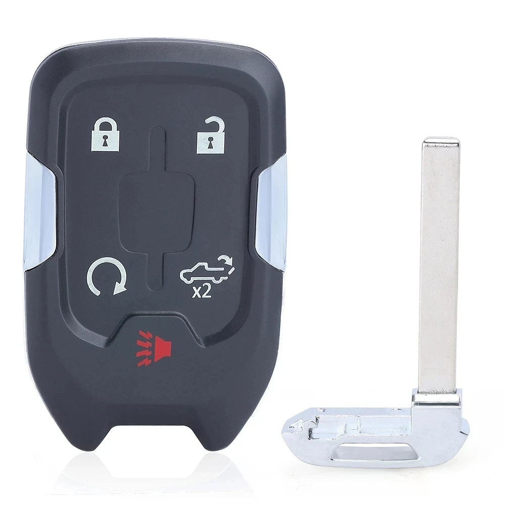 A dark gray remote key fob with a button and a silver key blade attached.