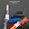 A white and orange double-barreled soft bullet launcher rifle is displayed on a dark surface with ammunition and accessories.