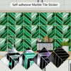 Self-adhesive marble tile stickers in various geometric patterns displayed against a green tiled wall.