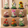 A set of miniature building blocks depicting various flowers and bouquets like roses and sunflowers.