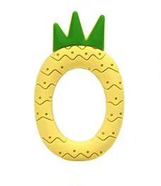 A yellow fruit-shaped silicone baby rattle teether with a green leafy top.