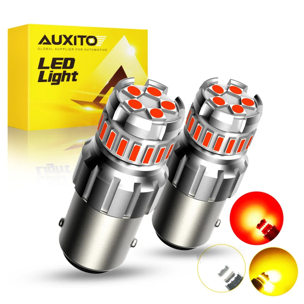 A pair of bright LED light bulbs for automotive use, shown next to its packaging and a disassembled bulb.