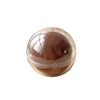 A clear, spherical stress ball with a translucent brown or amber color.