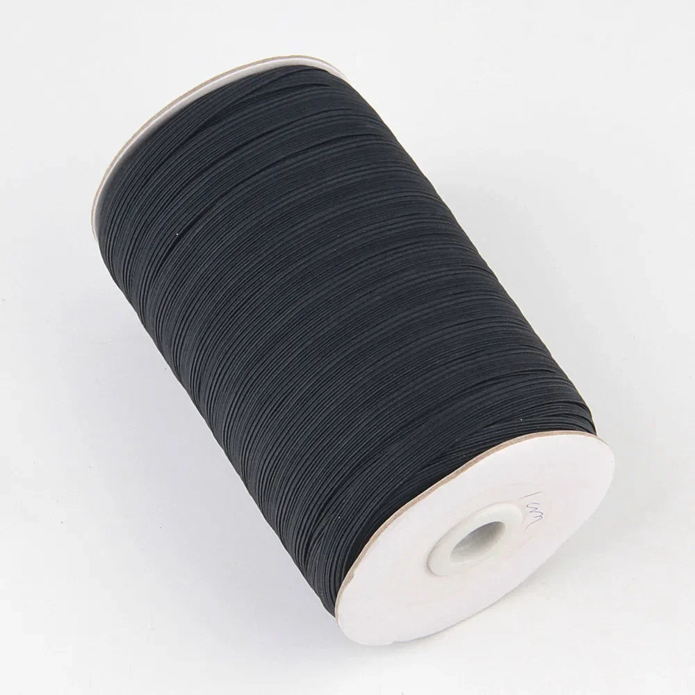 A roll of black polyester elastic bands for sewing and crafts.