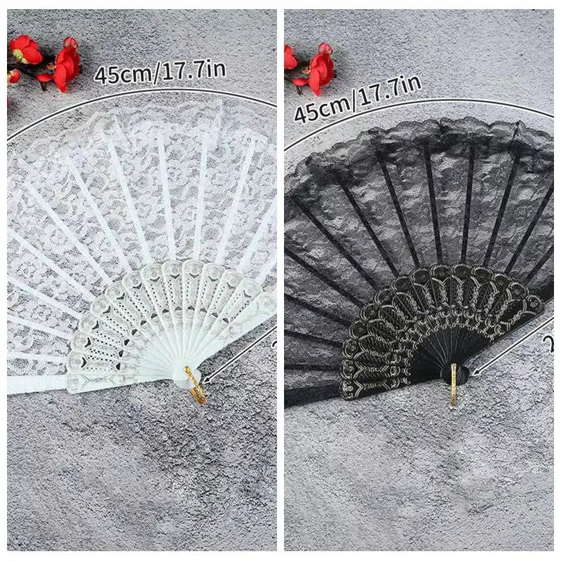A pair of vintage lace folding hand fans in white and black, shown with red flowers, measuring 45cm/17.7in.