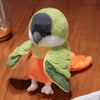 Adorable plush parrot hand puppet toy with green and gray feathers and an orange body.