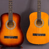 Two acoustic classical guitars in orange wood finish displayed against a gray background.