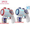Two astronaut bubble blaster toys, one red and one blue, are shown against a white background.