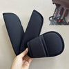 Black fabric cushion covers for baby stroller and car seat belts being held by a hand