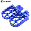 A set of blue CNC aluminum foot pegs designed for Yamaha dirt bikes.