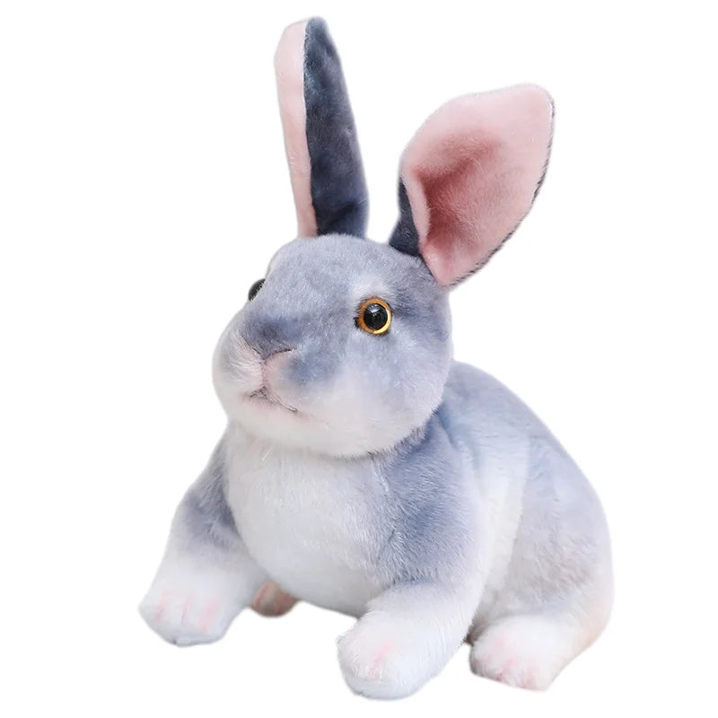 A gray and white plush rabbit stuffed animal with pink inner ears.
