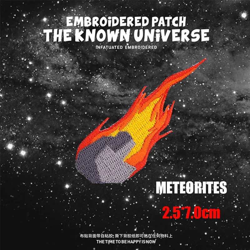 Embroidered patch design featuring a fiery meteorite against a starry background.