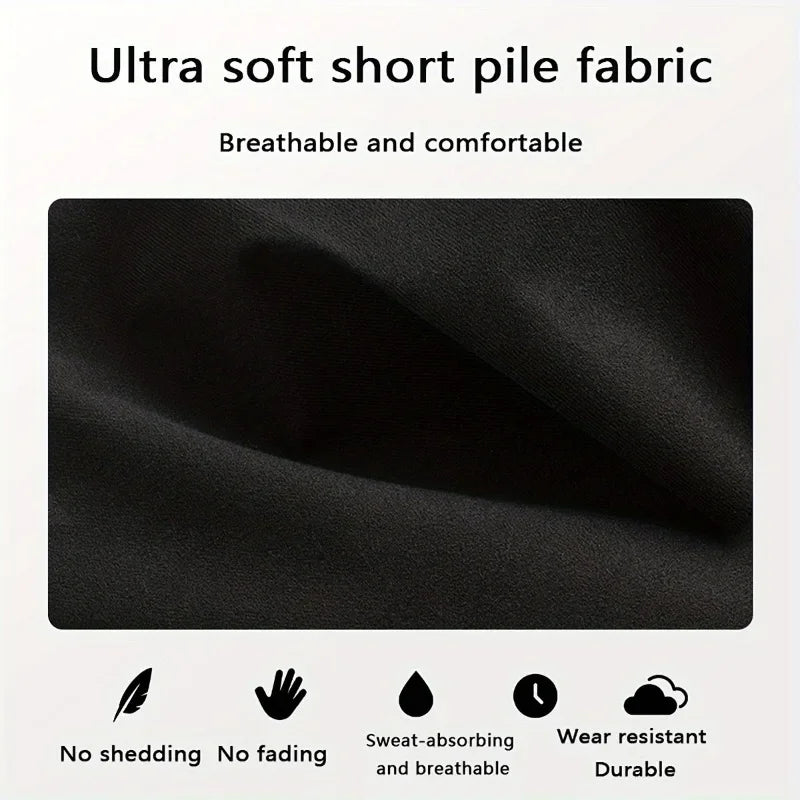 Close-up of a black ultra soft short pile fabric showing texture and features like no shedding, no fading, sweat-absorbing, a