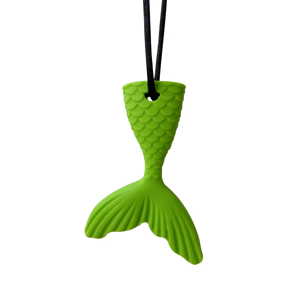 A bright green silicone sensory chew necklace pendant shaped like a fish tail.