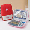 A red and white portable mini first aid kit organizer bag with a clear compartment for medical supplies.