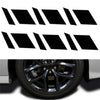 A set of six black reflective wheel hub stickers arranged in a row.