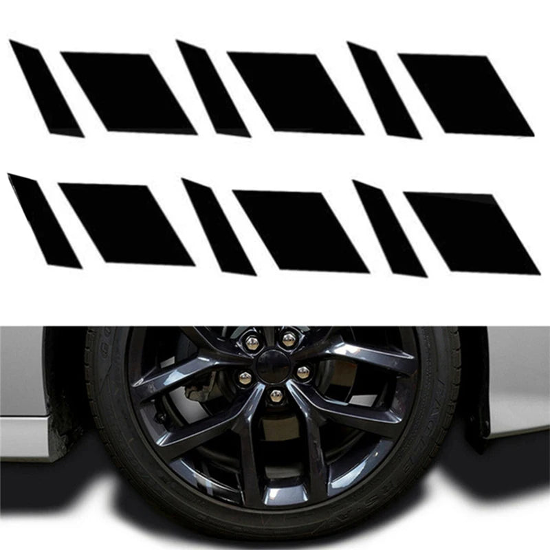 A set of six black reflective wheel hub stickers arranged in a row.