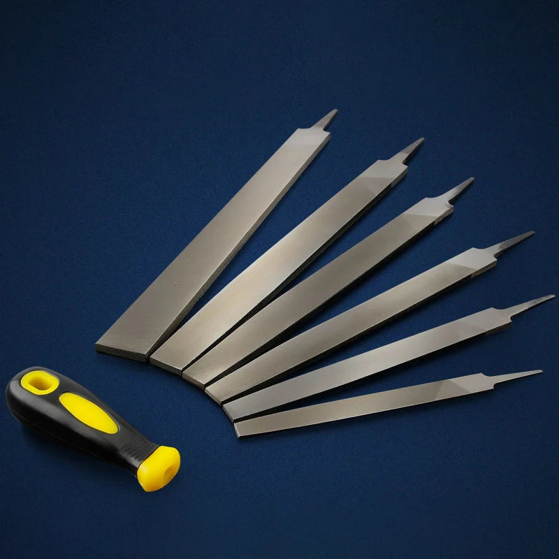 A set of T12 high carbon steel flat files with yellow handles arranged diagonally on a dark blue surface.