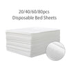 A stack of white disposable bed sheets, packaged in quantities of 20, 40, 60, and 80 pieces.