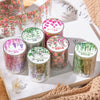 A collection of colorful Mountain Vines decorative PET tape in various shades and patterns displayed on a white surface.