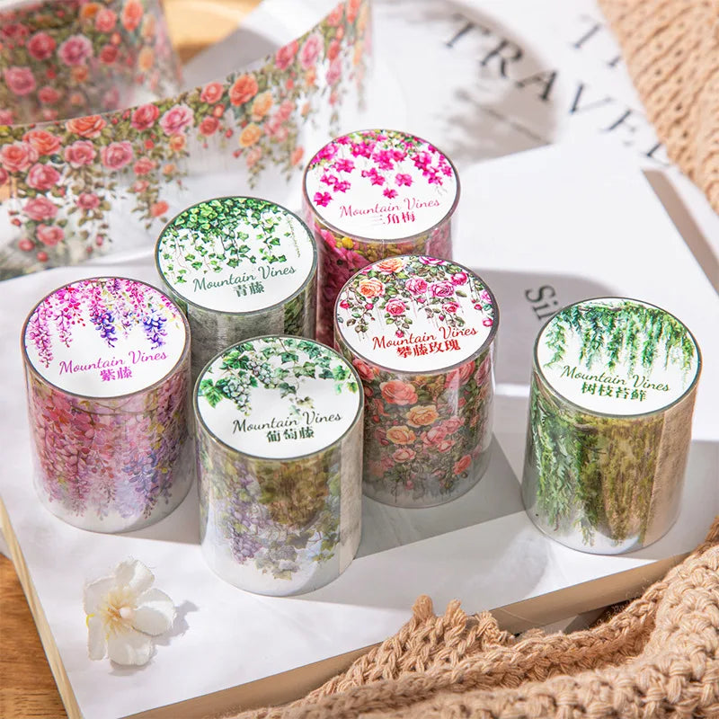 A collection of colorful Mountain Vines decorative PET tape in various shades and patterns displayed on a white surface.