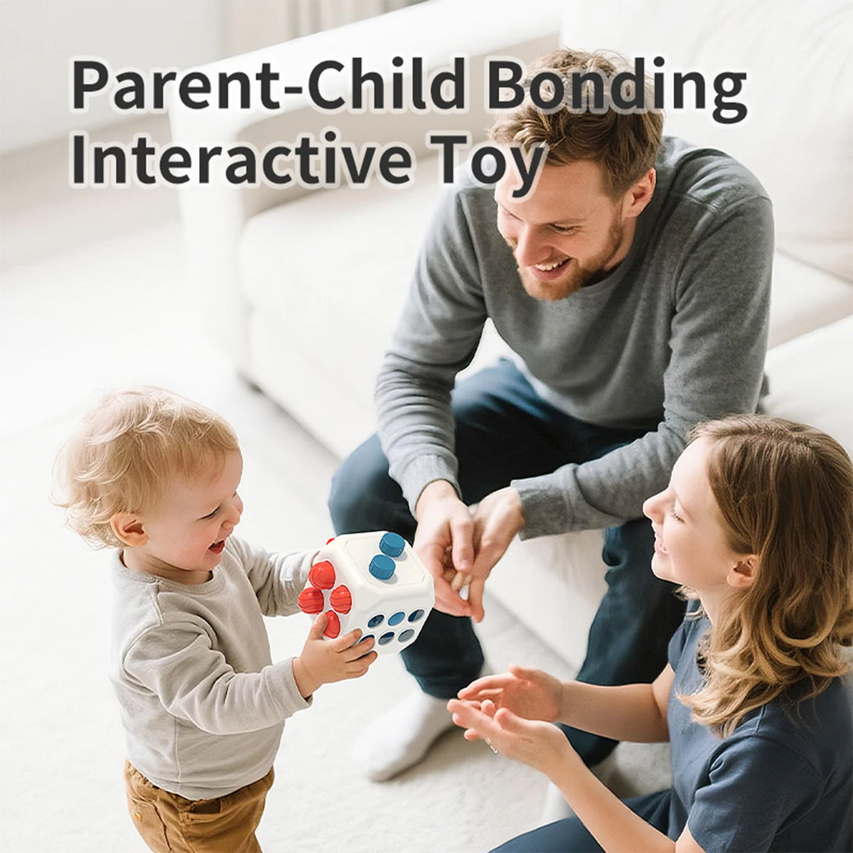 A father is interacting with his young son while a mother watches, demonstrating a parent-child bonding toy.