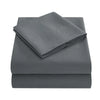 A stack of gray soft brushed microfiber bedding including a fitted sheet, flat sheet, and pillowcases.