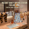 Instant vanity drying station for any sink featuring a retractable clothesline with 12 clothespins.