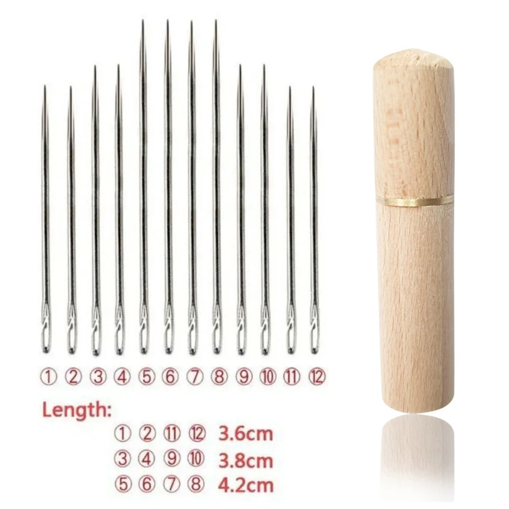 A set of twelve self-threading sewing needles with tips and a wooden storage case.